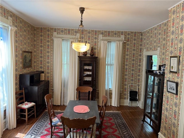 222 W Gay St, Warrensburg, MO 64093 - dining space featuring wood finished floors, plenty of natural light, and wallpapered walls