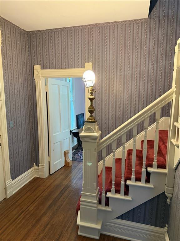 222 W Gay St, Warrensburg, MO 64093 - staircase with wood finished floors