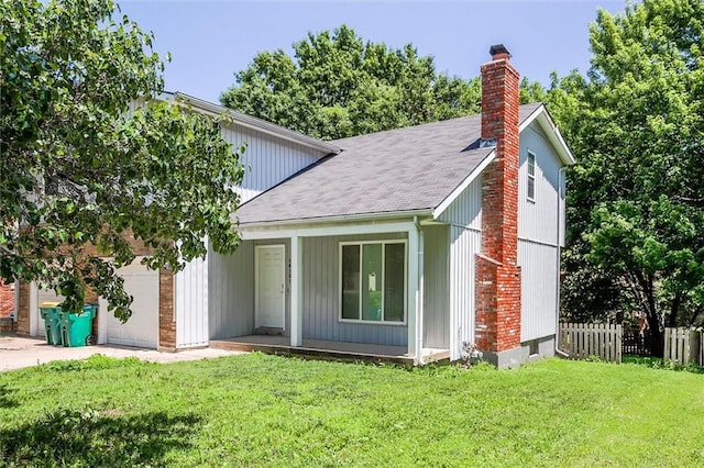 10151 W 84th St, Overland Park, KS 66212 - view of front of property with an attached garage, a chimney, and a shingled roof
