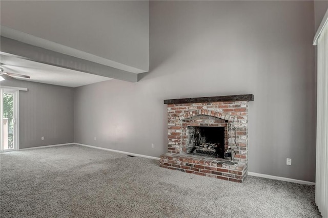 10151 W 84th St, Overland Park, KS 66212 - unfurnished living room featuring carpet flooring, a fireplace, ceiling fan, and a high ceiling