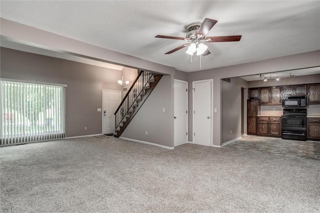 10151 W 84th St, Overland Park, KS 66212 - unfurnished living room with stairs, carpet floors, a ceiling fan, and rail lighting