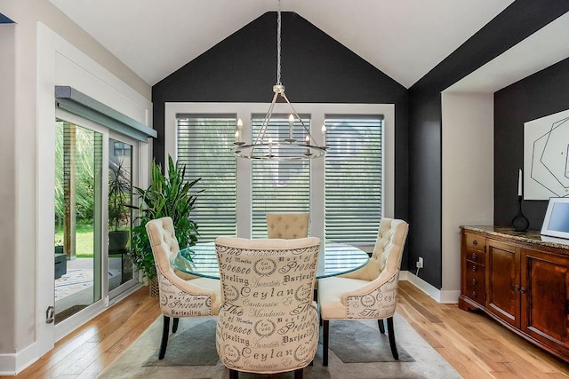 6614 Mccormick Dr, Shawnee, KS 66226 - dining room featuring light wood-type flooring, plenty of natural light, a chandelier, and vaulted ceiling
