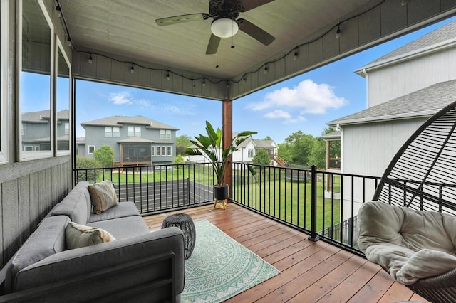 16486 S Chalet Dr, Olathe, KS 66062 - deck with ceiling fan, a lawn, a residential view, and an outdoor living space