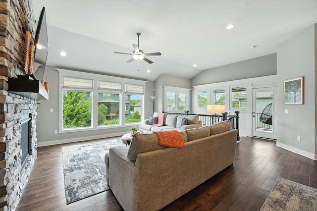 16486 S Chalet Dr, Olathe, KS 66062 - living room featuring a ceiling fan, a stone fireplace, dark wood-type flooring, vaulted ceiling, and recessed lighting