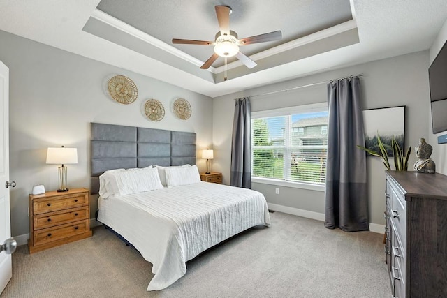 16486 S Chalet Dr, Olathe, KS 66062 - bedroom featuring a tray ceiling, light carpet, ornamental molding, and ceiling fan