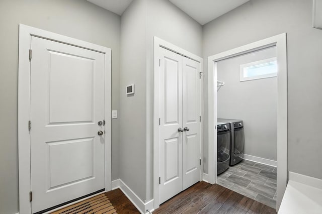 16486 S Chalet Dr, Olathe, KS 66062 - foyer entrance with dark wood-style floors and washer and clothes dryer