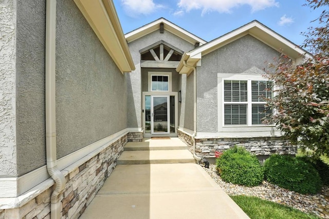 16486 S Chalet Dr, Olathe, KS 66062 - doorway to property with stucco siding and stone siding