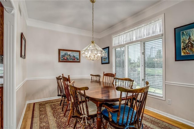 17801 E 30th St S, Independence, MO 64057 - dining space with wood finished floors, crown molding, and a chandelier