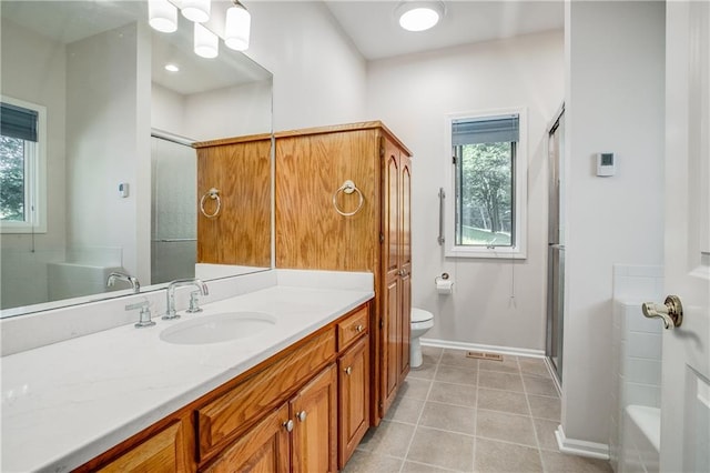 17801 E 30th St S, Independence, MO 64057 - bathroom featuring vanity, an enclosed shower, tile patterned flooring, a chandelier, and a tub