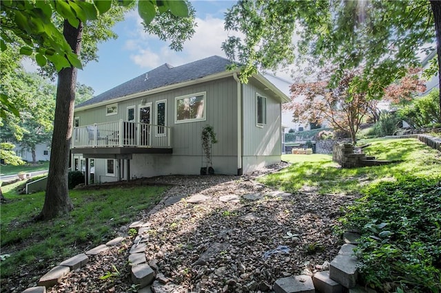 17801 E 30th St S, Independence, MO 64057 - rear view of property featuring a deck, a lawn, and a shingled roof