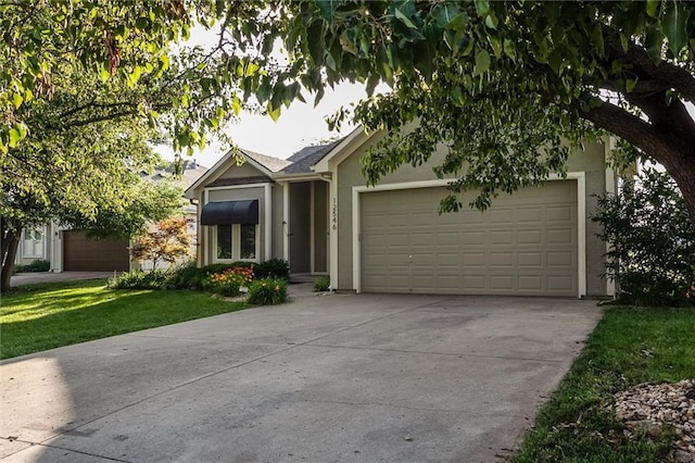 12546 Augusta Dr, Kansas City, KS 66109 - view of front of house with stucco siding, a garage, concrete driveway, and a front lawn