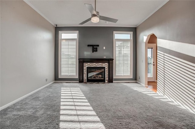 12546 Augusta Dr, Kansas City, KS 66109 - unfurnished living room with carpet floors, ornamental molding, ceiling fan, and a fireplace
