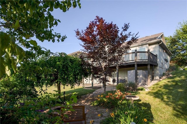 12546 Augusta Dr, Kansas City, KS 66109 - rear view of house with a lawn and a wooden deck