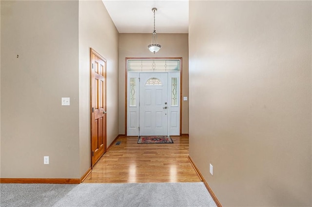 11180 Riverview Ave, Edwardsville, KS 66111 - entrance foyer featuring baseboards and light colored carpet