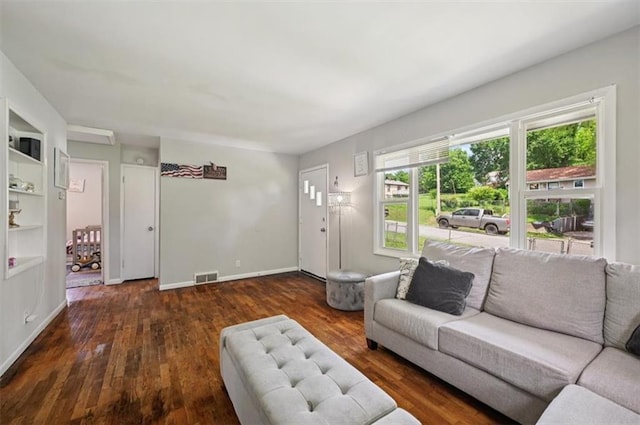 919 Walnut St, Leavenworth, KS 66048 - living room featuring wood finished floors and baseboards