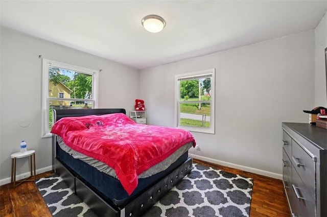 919 Walnut St, Leavenworth, KS 66048 - bedroom featuring multiple windows and dark wood-type flooring