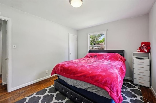 919 Walnut St, Leavenworth, KS 66048 - bedroom with wood finished floors and baseboards