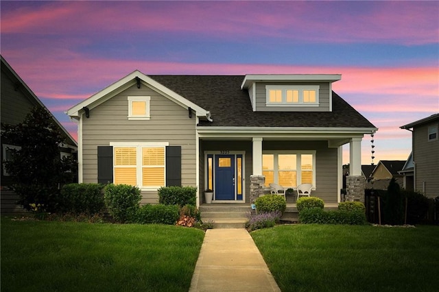 3225 SW Longview Rd, Lees Summit, MO 64081 - view of front of home featuring covered porch, a yard, and a shingled roof