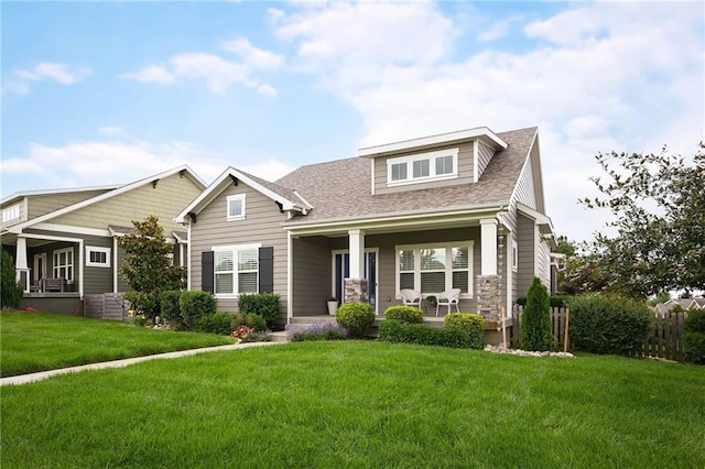 3225 SW Longview Rd, Lees Summit, MO 64081 - craftsman-style home with a porch, a front yard, and roof with shingles