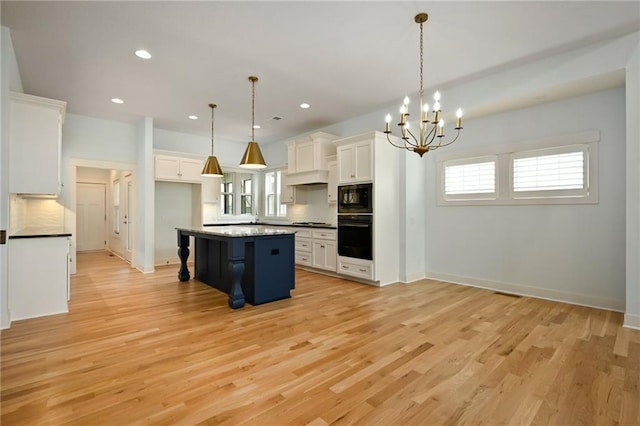 3225 SW Longview Rd, Lees Summit, MO 64081 - kitchen with black appliances, white cabinets, healthy amount of natural light, and recessed lighting
