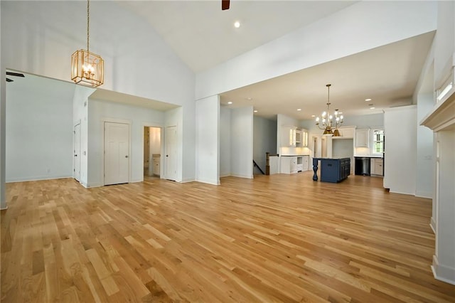 3225 SW Longview Rd, Lees Summit, MO 64081 - unfurnished living room featuring a chandelier, light wood finished floors, high vaulted ceiling, and recessed lighting