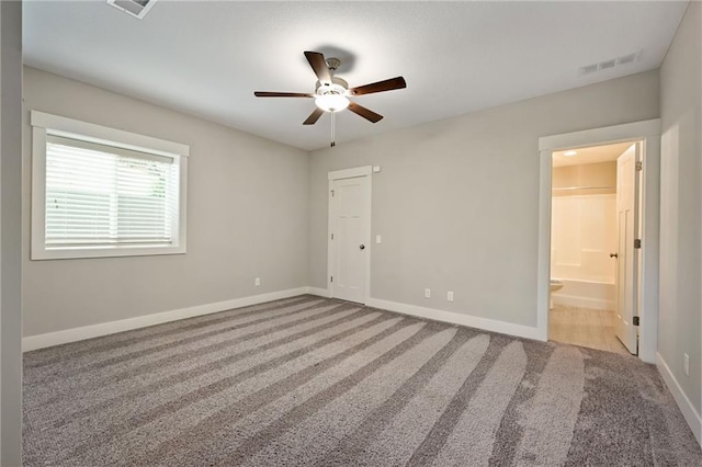 3225 SW Longview Rd, Lees Summit, MO 64081 - unfurnished bedroom with carpet floors, connected bathroom, and ceiling fan