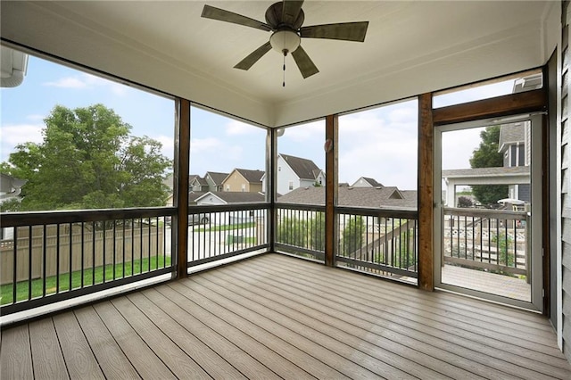 3225 SW Longview Rd, Lees Summit, MO 64081 - unfurnished sunroom with ceiling fan, wood finished floors, and plenty of natural light