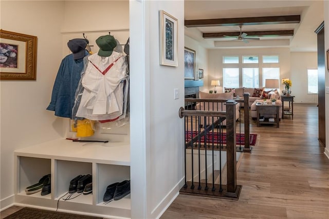 1301 NE 123rd St, Kansas City, MO 64165 - hall featuring wood finished floors, beamed ceiling, and an upstairs landing