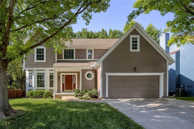 18380 W 116th St, Olathe, KS 66061 - traditional-style house featuring driveway, roof with shingles, and an attached garage