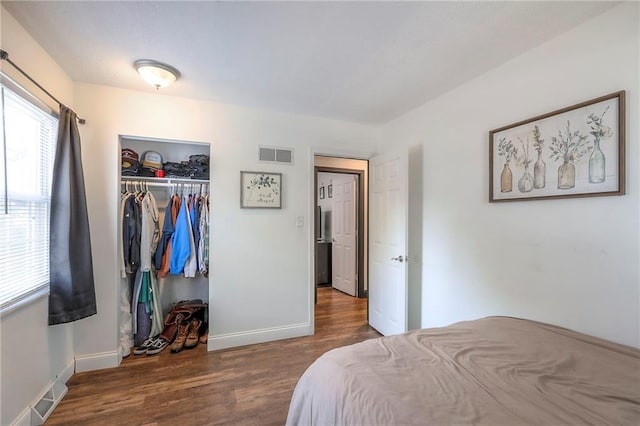 1108 NW Canterbury Rd, Blue Springs, MO 64015 - bedroom with wood finished floors and a closet