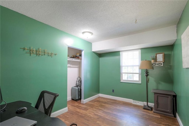1108 NW Canterbury Rd, Blue Springs, MO 64015 - office featuring wood finished floors and a textured ceiling