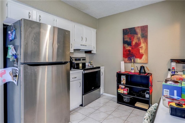 11400 Monroe Ave, Kansas City, MO 64137 - kitchen with appliances with stainless steel finishes, under cabinet range hood, white cabinets, light tile patterned floors, and light countertops