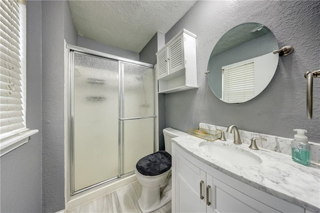 11400 Monroe Ave, Kansas City, MO 64137 - bathroom with a shower stall, vanity, a textured ceiling, and a textured wall