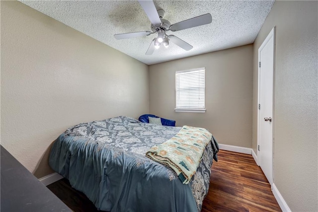11400 Monroe Ave, Kansas City, MO 64137 - bedroom with a textured ceiling, wood finished floors, a ceiling fan, and a textured wall