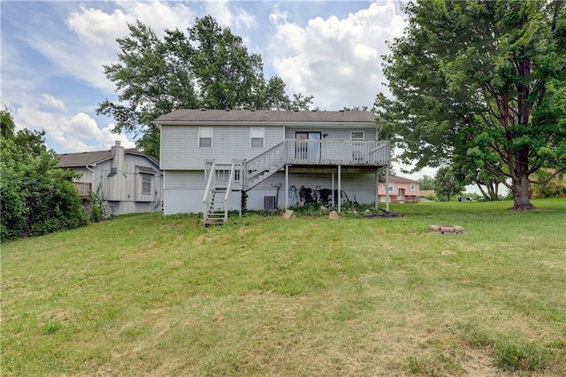 11400 Monroe Ave, Kansas City, MO 64137 - rear view of house with stairs, a deck, and a lawn