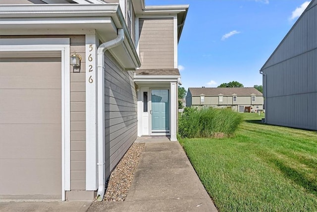 5626 NW Moonlight Meadow Ct, Lees Summit, MO 64064 - entrance to property featuring a lawn and a garage