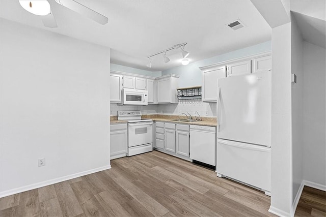 5626 NW Moonlight Meadow Ct, Lees Summit, MO 64064 - kitchen with white appliances, light wood-type flooring, white cabinetry, light countertops, and a ceiling fan