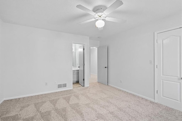 5626 NW Moonlight Meadow Ct, Lees Summit, MO 64064 - unfurnished bedroom featuring carpet, ensuite bathroom, and a ceiling fan