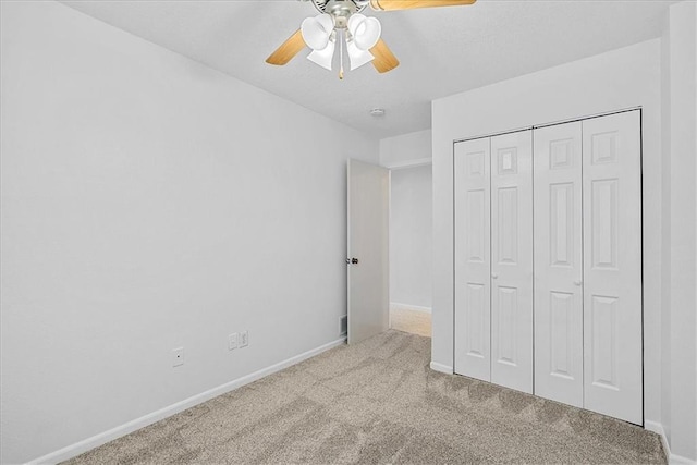 5626 NW Moonlight Meadow Ct, Lees Summit, MO 64064 - unfurnished bedroom featuring carpet floors, a closet, and a ceiling fan