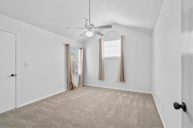 5626 NW Moonlight Meadow Ct, Lees Summit, MO 64064 - carpeted empty room with a ceiling fan, vaulted ceiling, and a textured ceiling