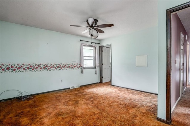 11301 Deer Haven Ln, Excelsior Springs, MO 64024 - unfurnished bedroom with carpet flooring, a textured ceiling, and ceiling fan