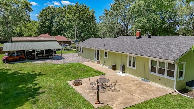 2633 E Langsford Rd, Lees Summit, MO 64063 - back of property featuring board and batten siding, roof with shingles, a chimney, and a yard