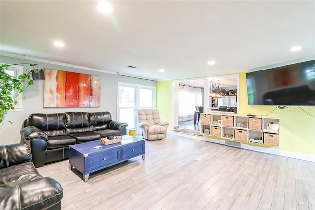 2633 E Langsford Rd, Lees Summit, MO 64063 - living room with wood finished floors, recessed lighting, and crown molding