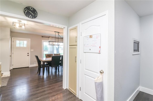 2633 E Langsford Rd, Lees Summit, MO 64063 - foyer entrance featuring dark wood-style flooring and baseboards