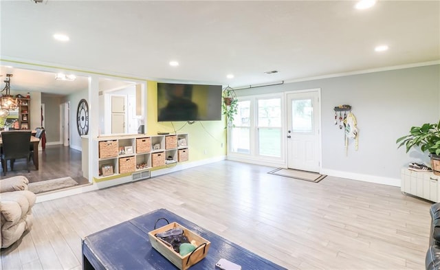 2633 E Langsford Rd, Lees Summit, MO 64063 - living area with recessed lighting, ornamental molding, and wood finished floors