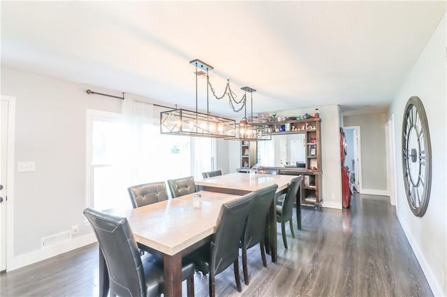 2633 E Langsford Rd, Lees Summit, MO 64063 - dining room with dark wood-type flooring and baseboards