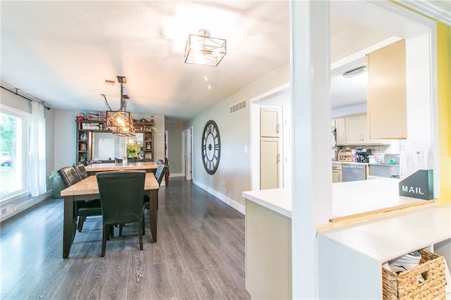 2633 E Langsford Rd, Lees Summit, MO 64063 - dining space featuring dark wood-style flooring and baseboards