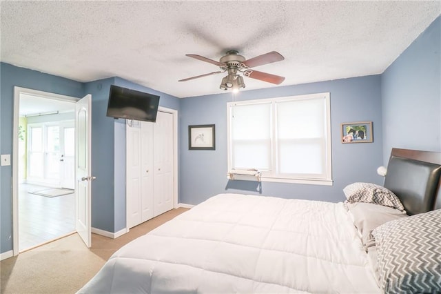 2633 E Langsford Rd, Lees Summit, MO 64063 - bedroom featuring carpet, ceiling fan, a textured ceiling, and a closet