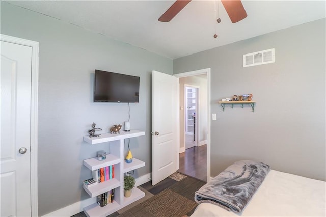 2633 E Langsford Rd, Lees Summit, MO 64063 - bedroom with wood finished floors and a ceiling fan