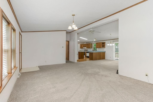 81 Enchanted Ln, Linn Valley, KS 66040 - unfurnished living room featuring a chandelier, ornamental molding, ceiling fan, and light colored carpet
